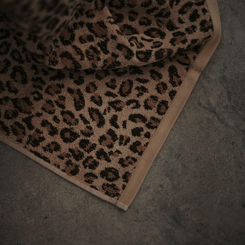 Leopard print rug on a concrete floor