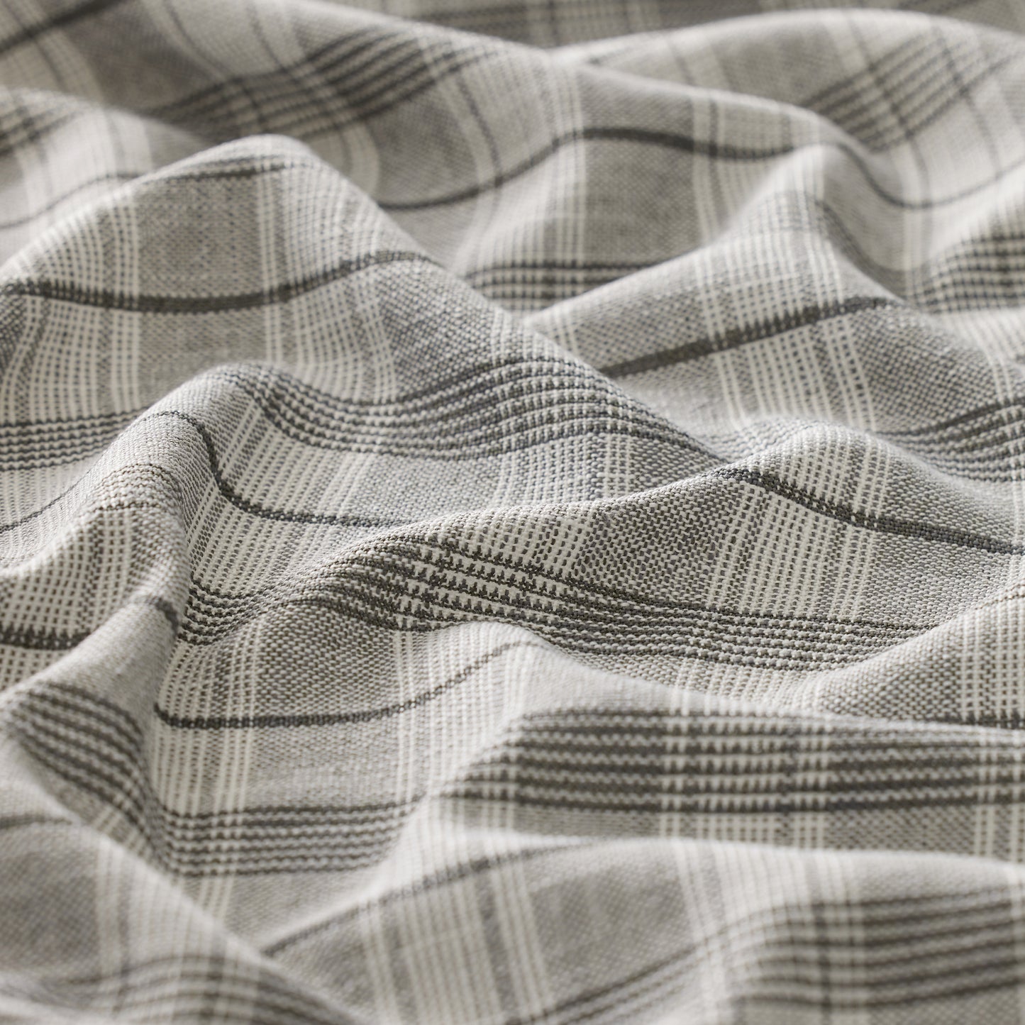 Close-up of textured fabric with a plaid pattern