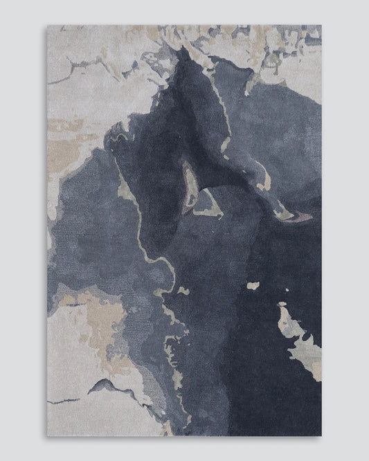 Abstract floor rug with blue, beige, and gray colors on a textured background