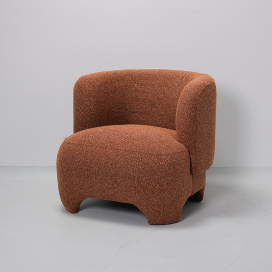 Brown textured armchair on a gray background