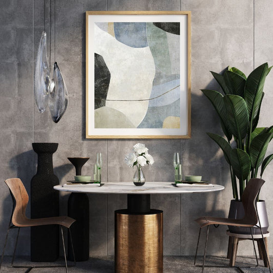 Modern interior with abstract art, table, chairs, and decorative items against a gray wall.