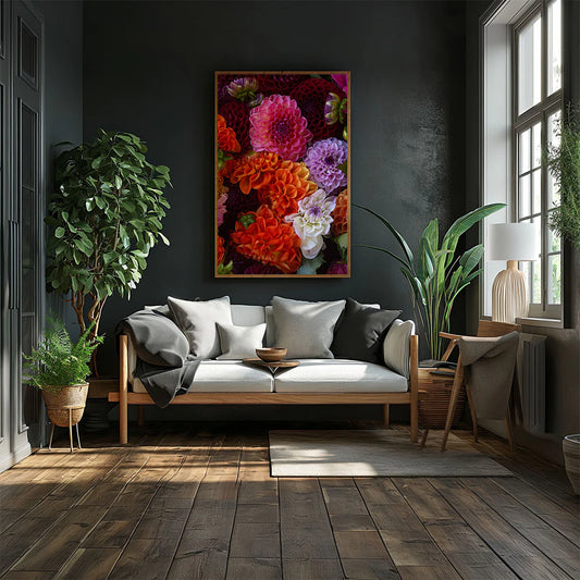 Modern living room with a gray sofa, decorative plants, and a colorful floral painting on a dark wall.