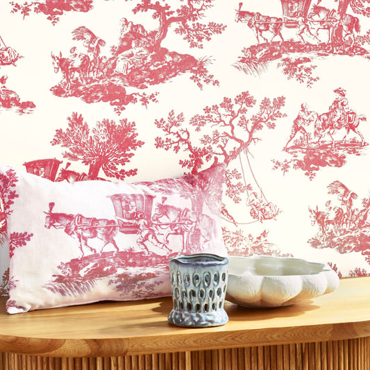 Pink toile patterned wallpaper with decorative elements on a white background.