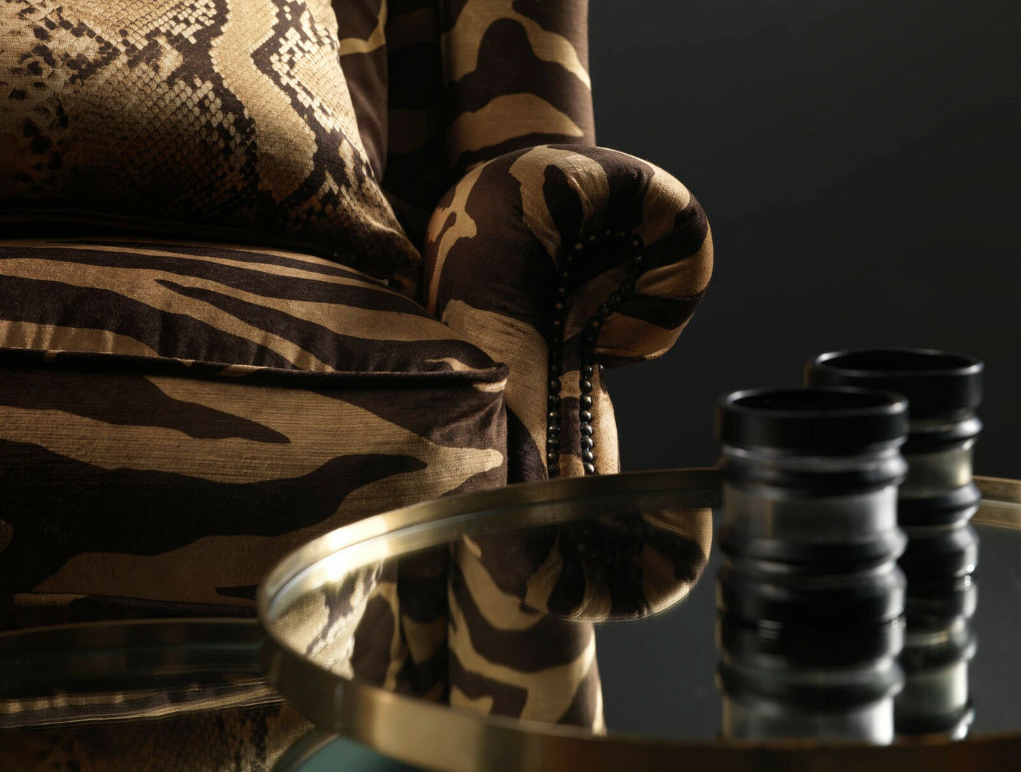 Camouflage-patterned chair with a reflective surface and gavel in the foreground