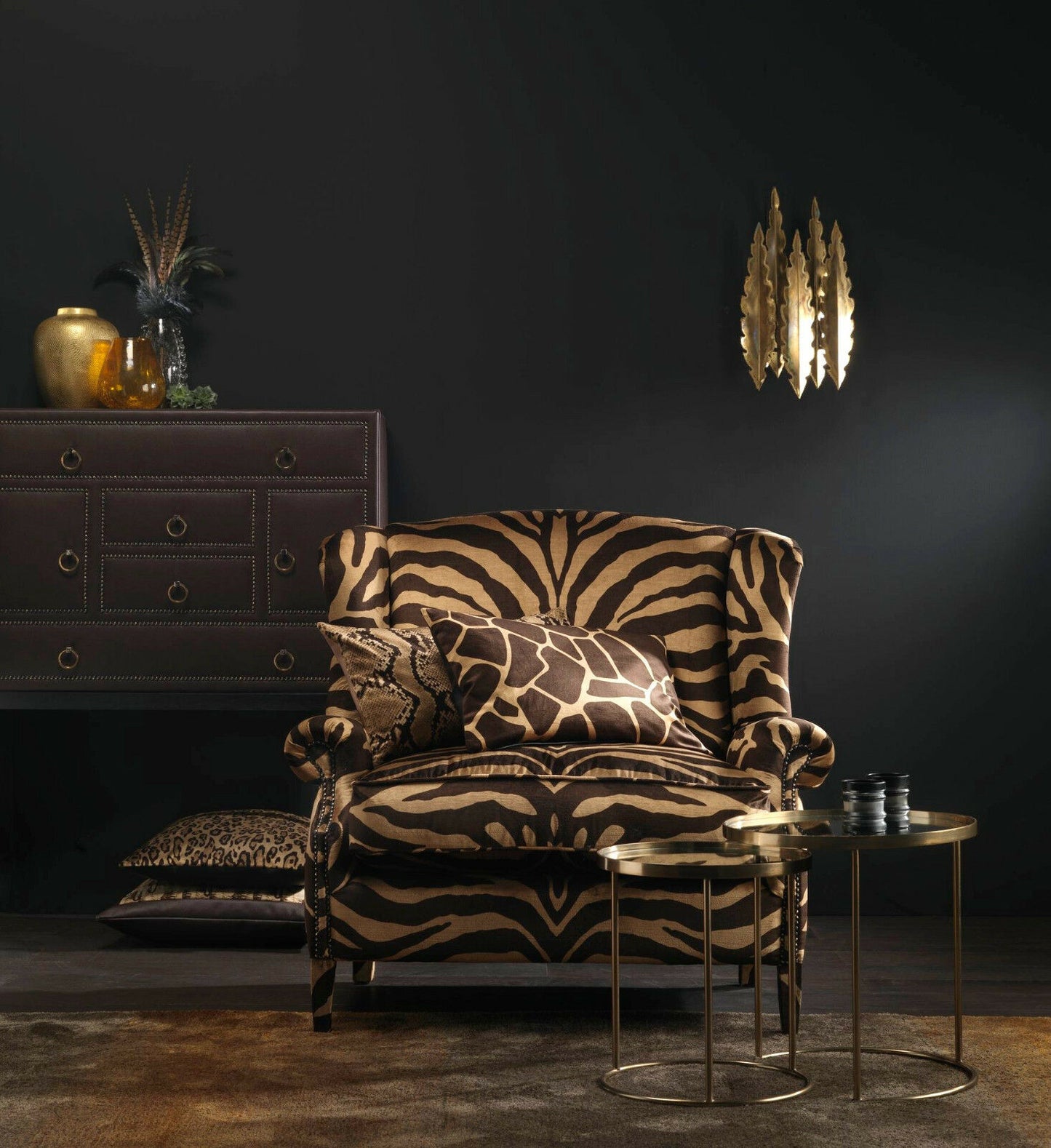 Luxury interior with zebra-patterned armchair, dark walls, and gold accents.