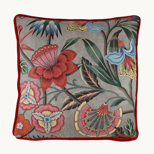 Cleo cushion with vibrant flowers and shapes in emerald, blue, pinks, brick and aquamarine