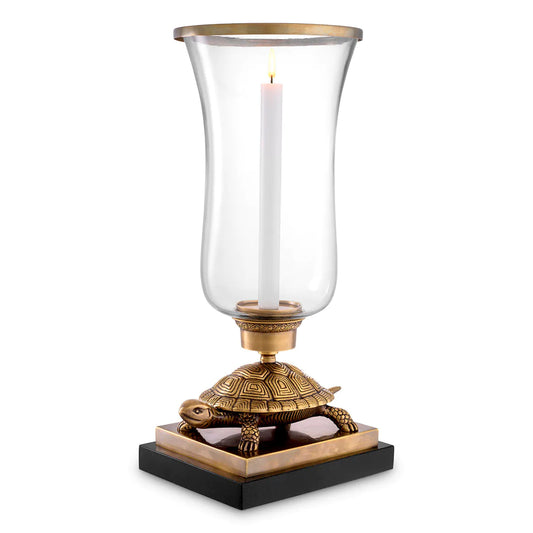 Eichholtz Huriricane Lamp with a tortoise brass bass on a black granite