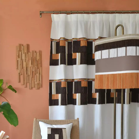 Room interior with a chair, plant, and patterned curtain.