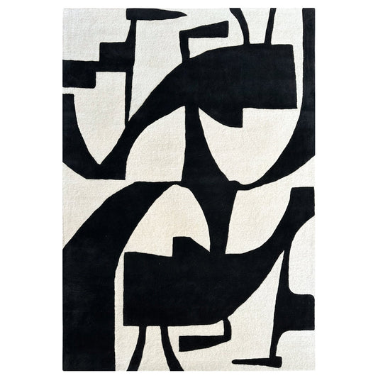 Abstract black and white rug with geometric patterns on a plain background