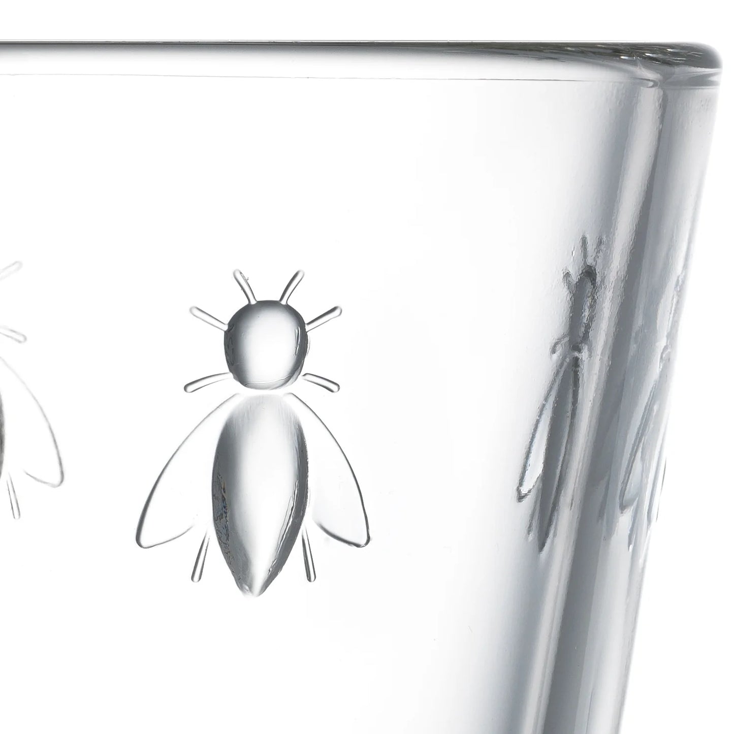 Clear glass vase with bee designs on a white background