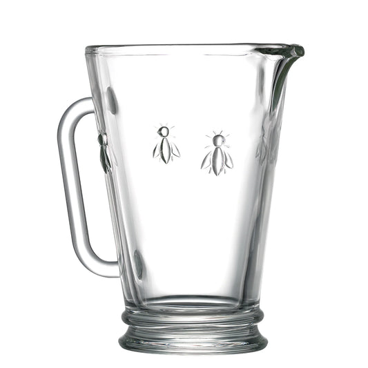Clear glass mug with bee designs on a white background