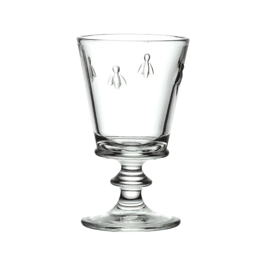Clear glass with decorative etching on a white background