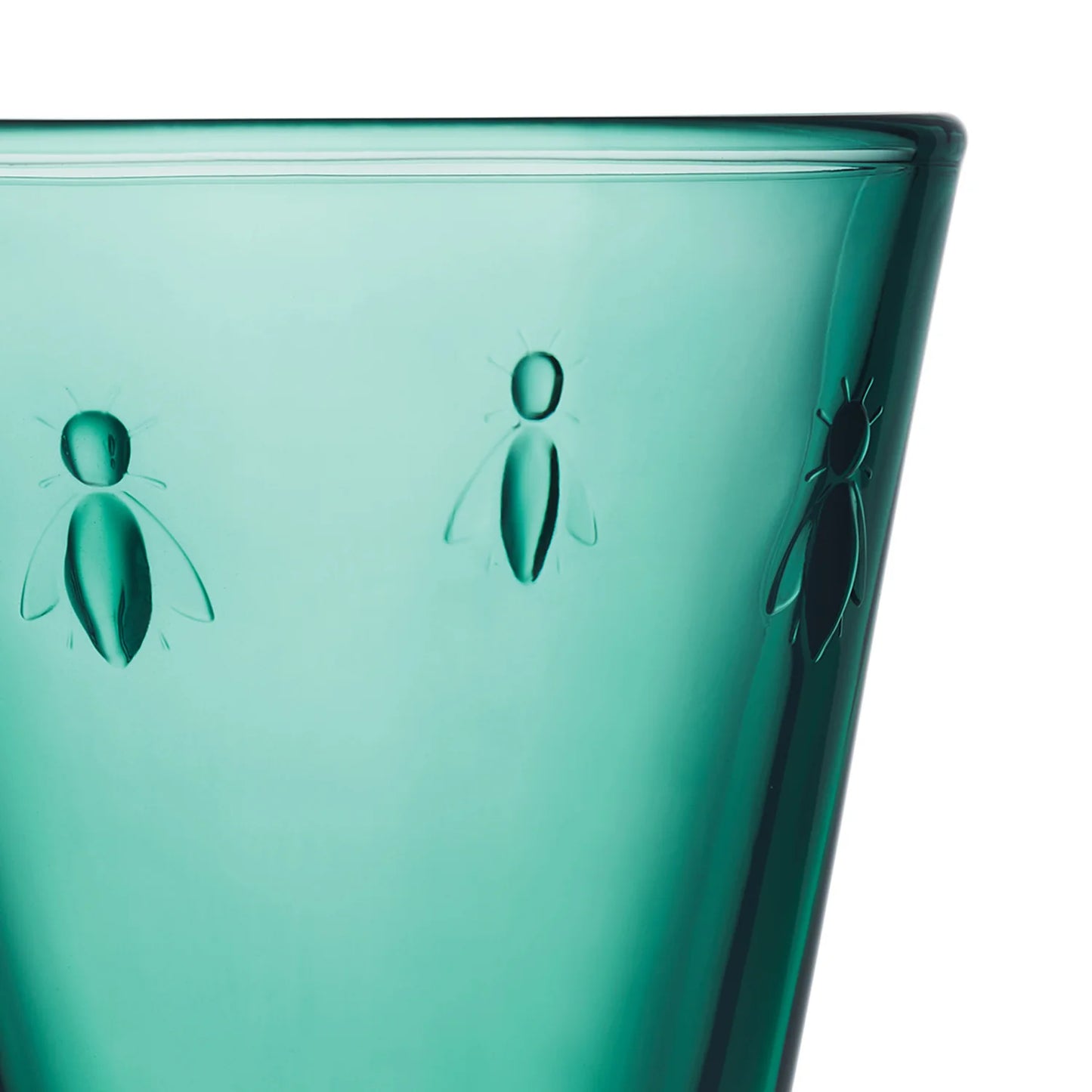Teal glass with embossed bee designs on a white background