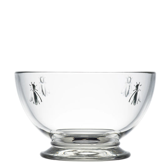 Clear glass bowl with engraved designs on a white background