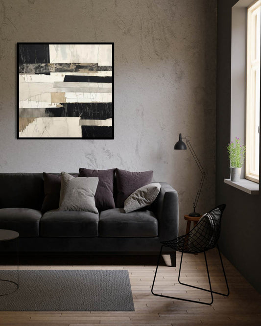Modern living room with a gray sofa, abstract art, and a lamp.
