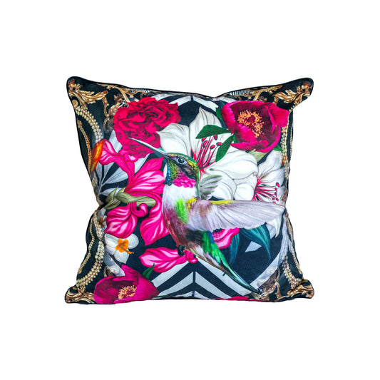 vibrant lily bird cushion featuring a hummingbird surrounds by bring flowers on a black background