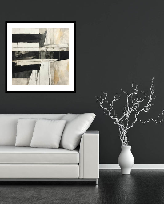 Modern living room with a gray sofa, abstract art on the wall, and a vase with branches.