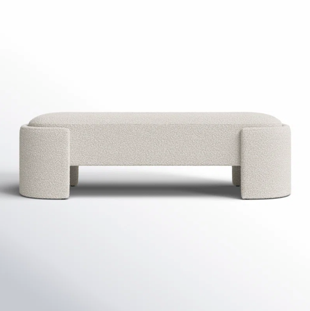 Beige upholstered bench on a white background