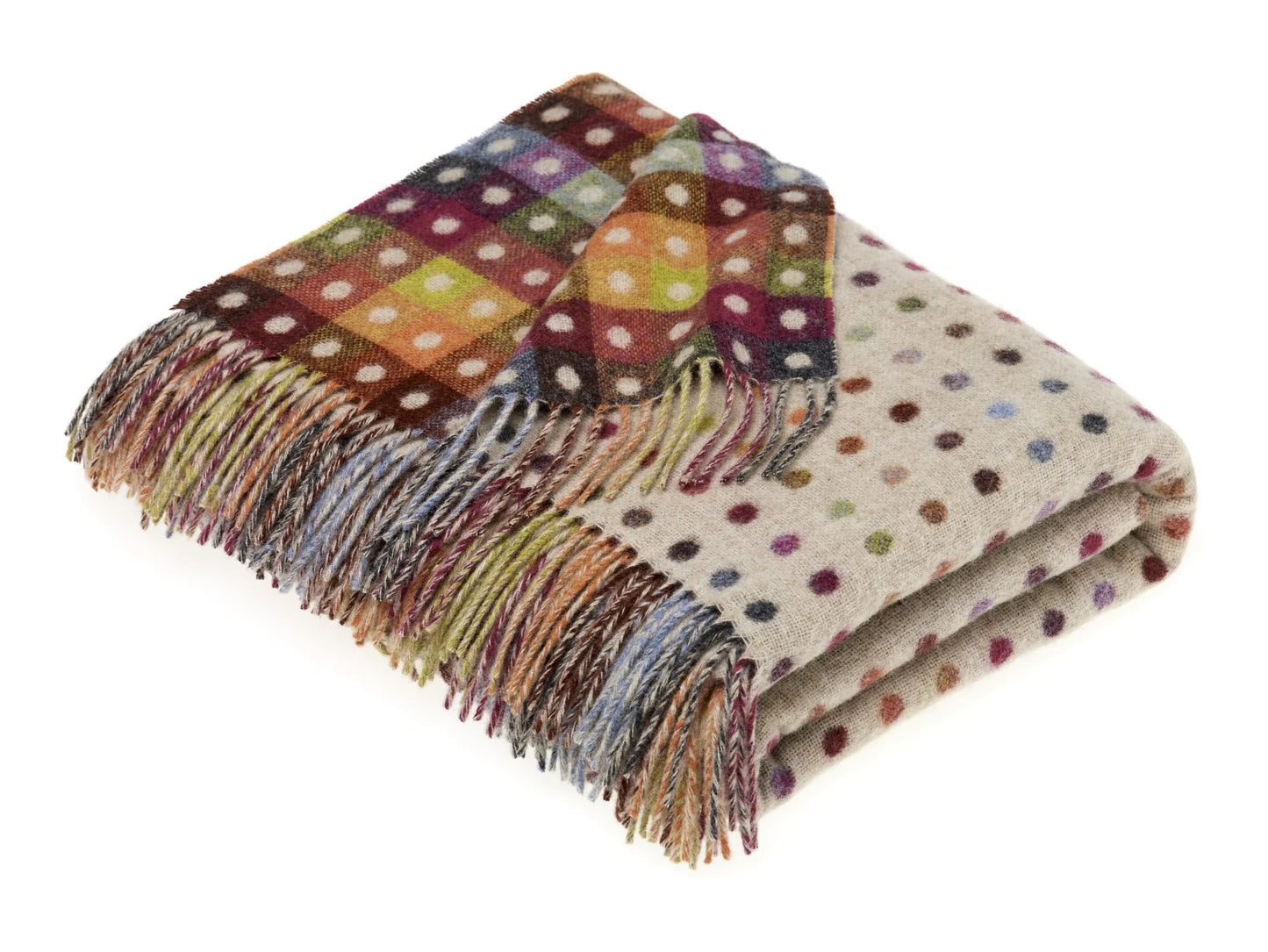 Multicolored polka dot throw blanket with fringes on a white background