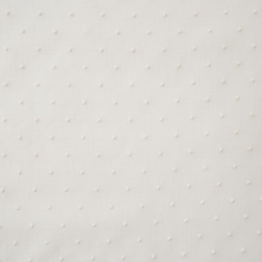 White drapery fabric embroidered with dots