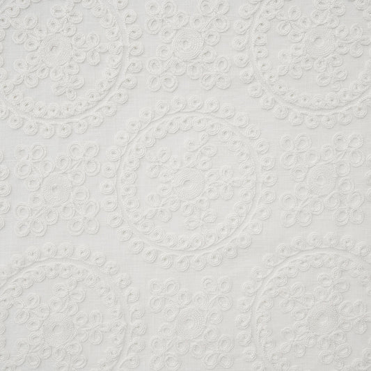 ivory embroidered fabric with circular patterns