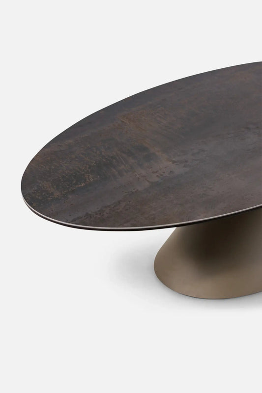 Dark brown oval table with a textured surface on a white background