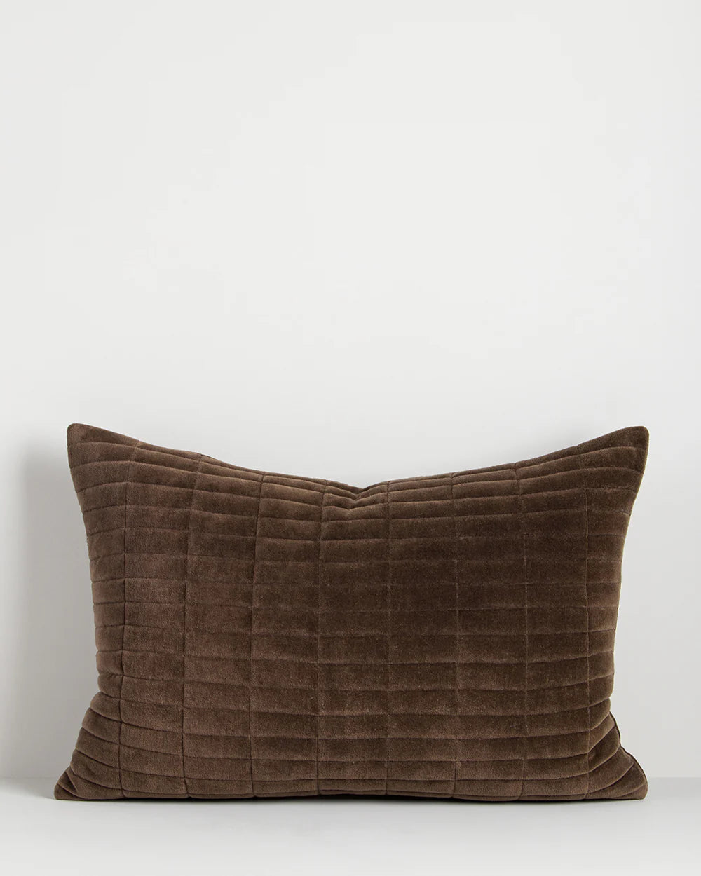 Brown textured pillow on a white background