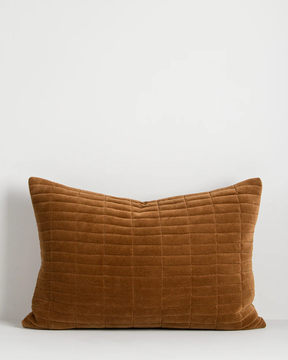 Brown textured pillow on a white background