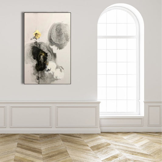 Abstract painting on a wall in a room with a large window