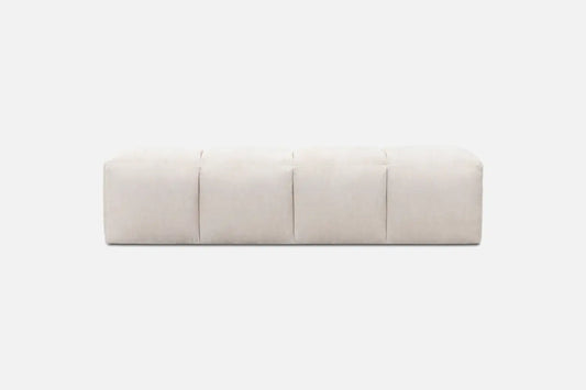 Cream fabric ottoman/bench in 4 padded stitched sections