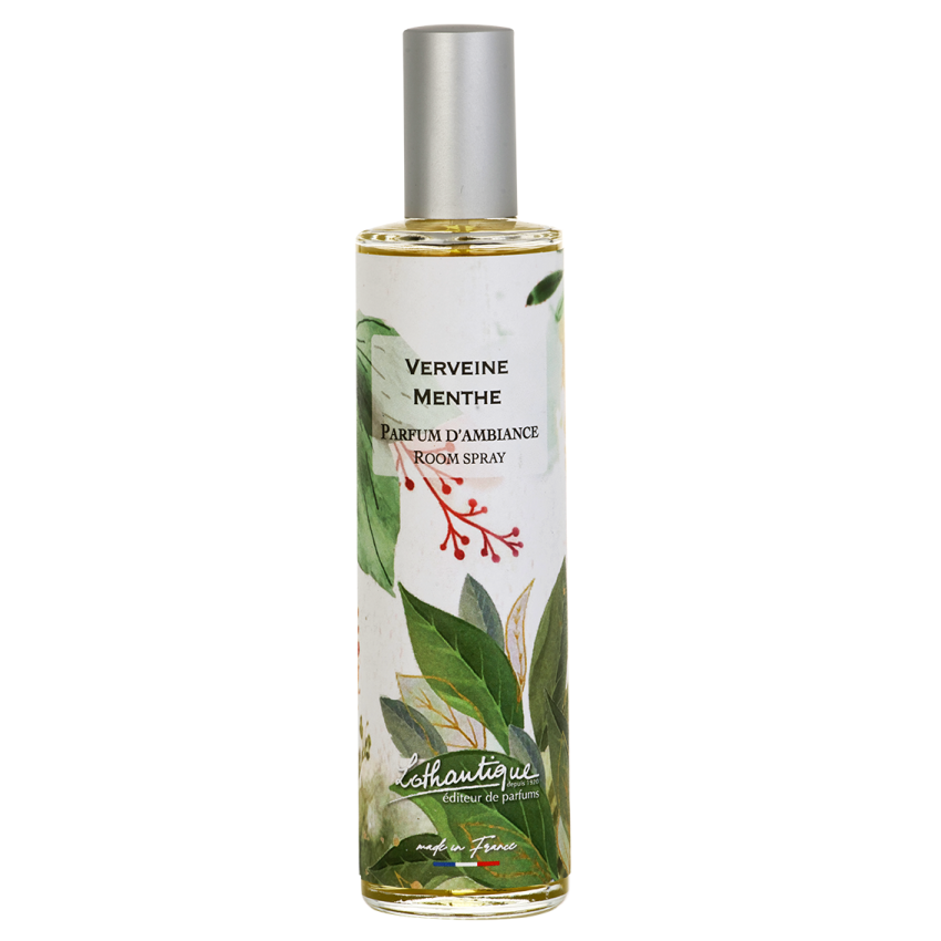Room spray bottle with green leaf design and white label on a white background