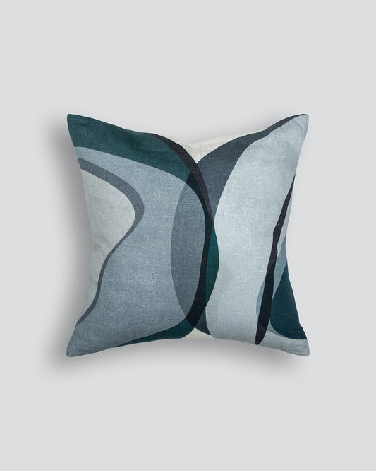 Decorative pillow with abstract design on a light gray background