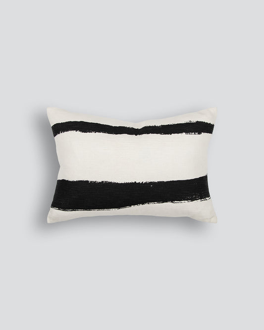 Decorative pillow with black stripes on a light gray background