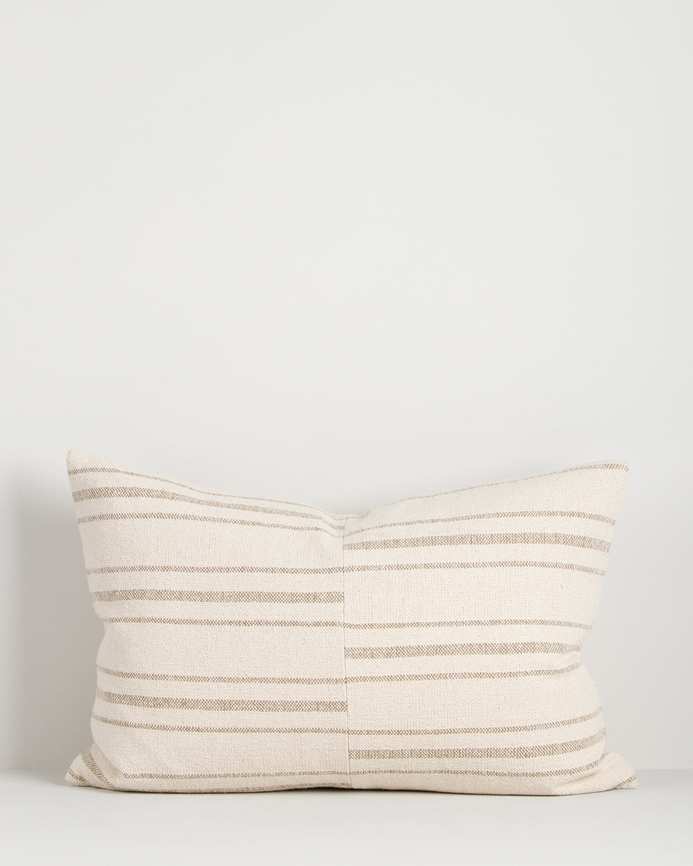 Striped pillow on a light gray background