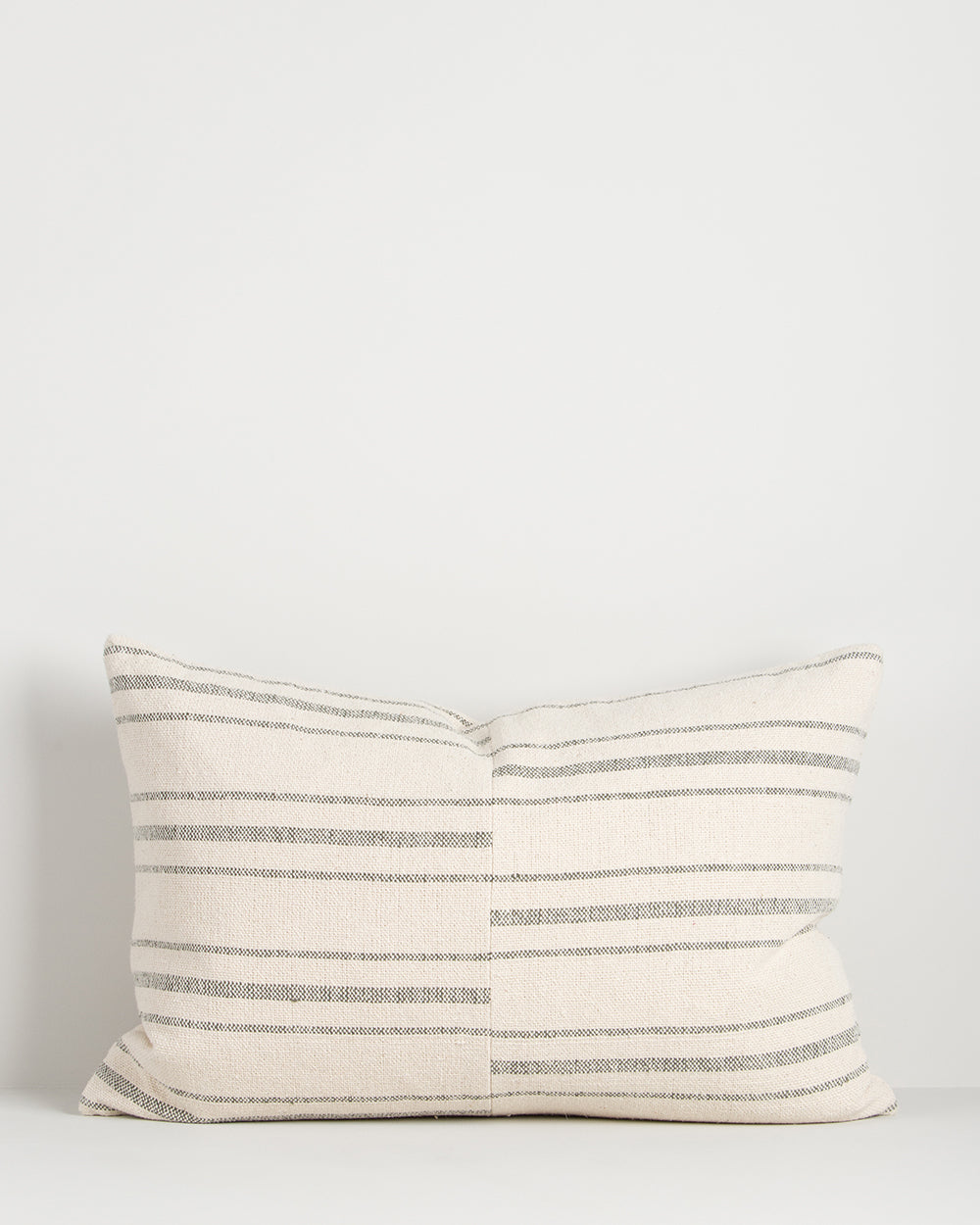 Striped pillow with a white background