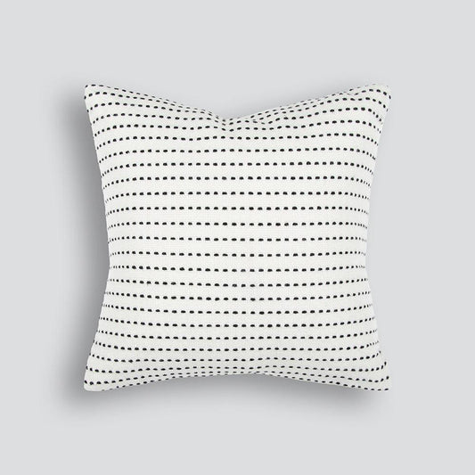 broken black stripe on a white outdoor cushion