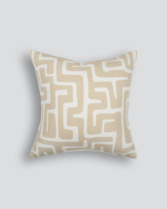 Decorative pillow with geometric pattern on a light gray background