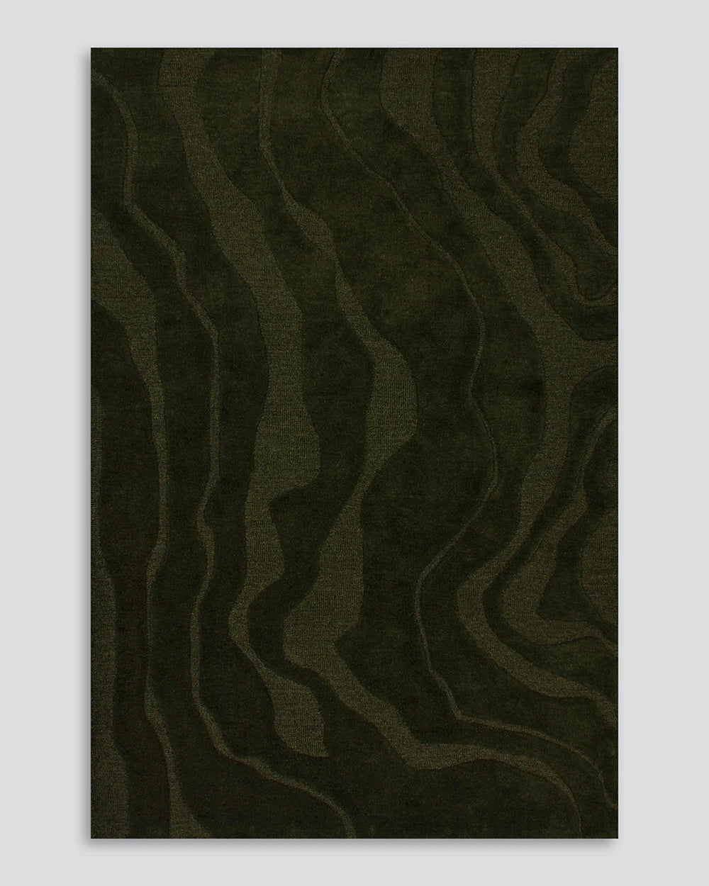 Dark green textured rug on a light gray background