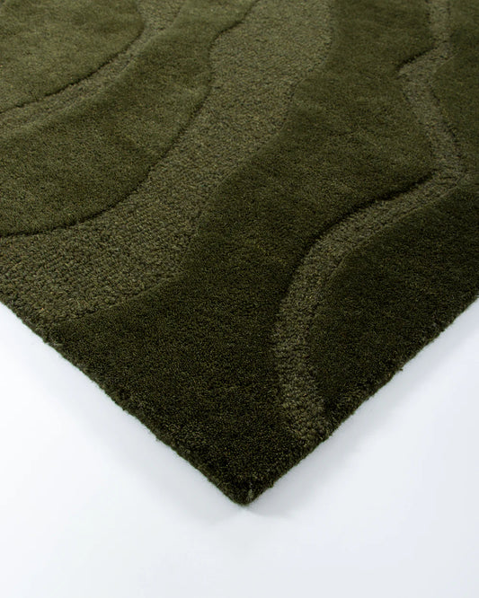 Close-up of a textured green rug on a white background