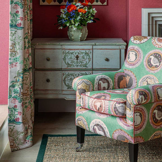 Robina's dinner party fabric in bright colours and patterns in a loungeroom setting from GP&J Baker