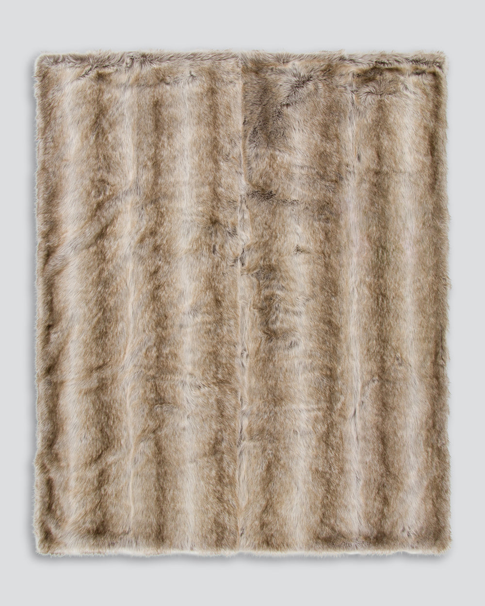 Textured brown fur throw on a white background