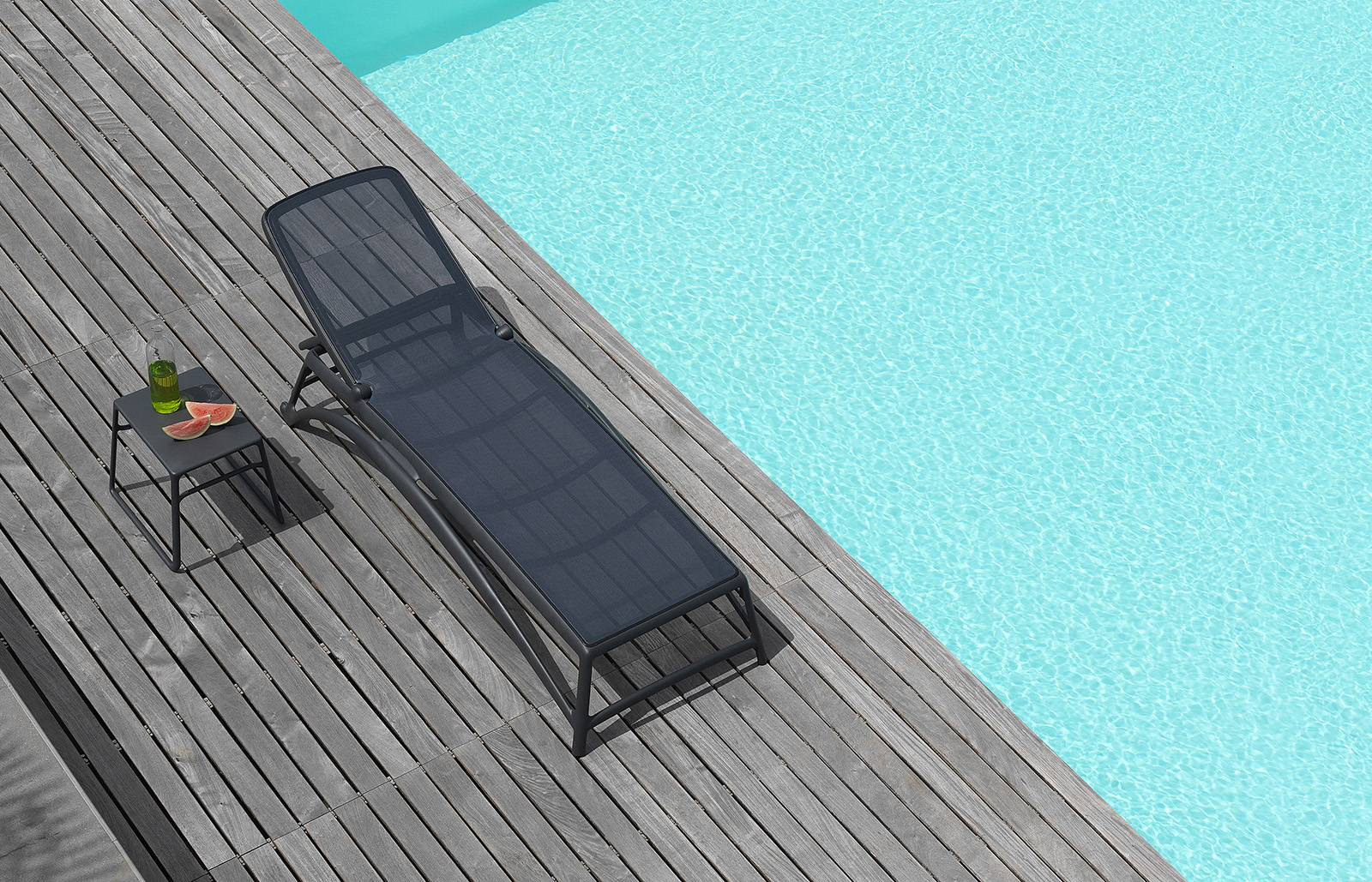 Atlantico sun lounger in charcoal by the pool, Nardi outdoor furniture