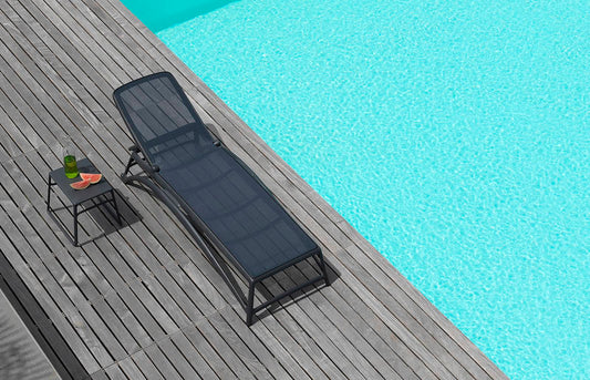 Atlantico sun lounger in charcoal by the pool, Nardi outdoor furniture