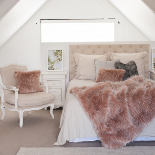 Luxury faux fur throw Peony Plume in pale pink from Heirloom. These are the best fake fur throws, super soft for NZ interior design