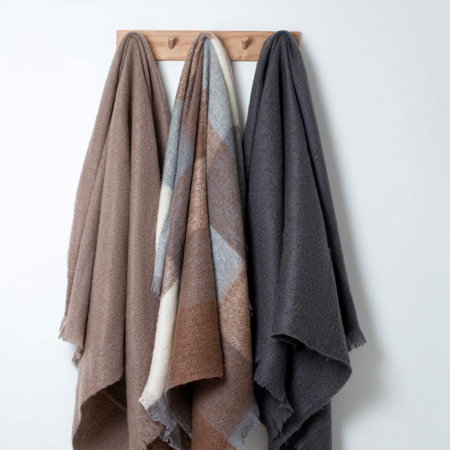 Soft Mohair luxury throws from Glamorous Goat. Mohair throw in Pembroke brown and grey check available at My Sanctuary