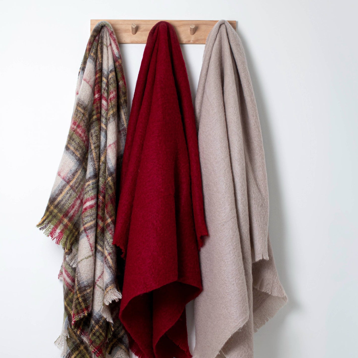 Soft Mohair luxury throws from Glamorous Goat in Pinot Noir red. Angora kid mohair throws available at My Sanctuary