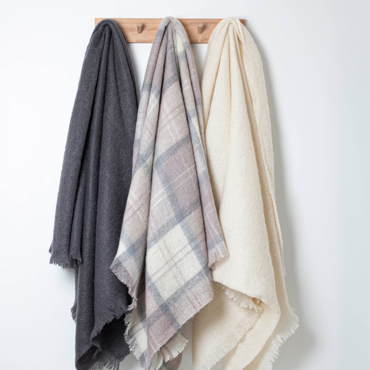 Soft Mohair luxury throws from Glamorous Goat in Wanaka Earth beige and grey chec. Angora kid mohair throws available at My Sanctuary
