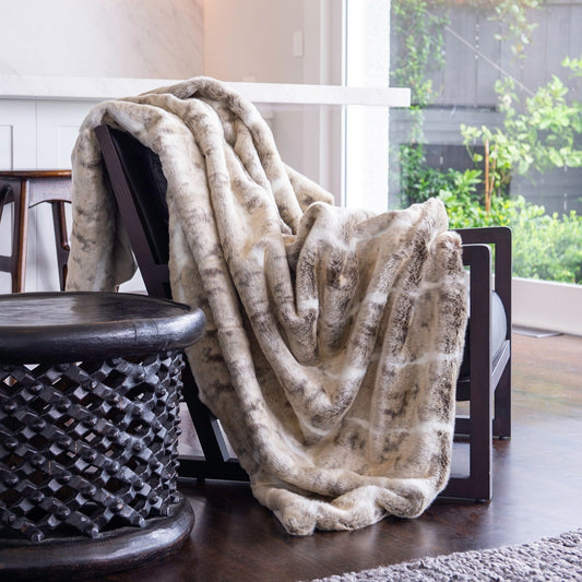 Luxury faux fur mountain rabbit throw in cream and brown from Heirloom. These are the best fake fur throws, super soft for NZ interior design FMNRT18