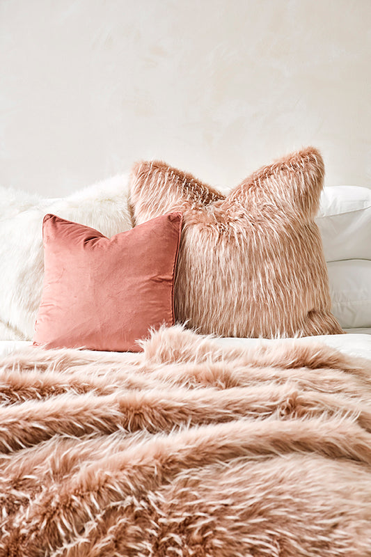 Luxury faux fur throw Peony Plume in pale pink from Heirloom. These are the best fake fur throws, super soft for NZ interior design