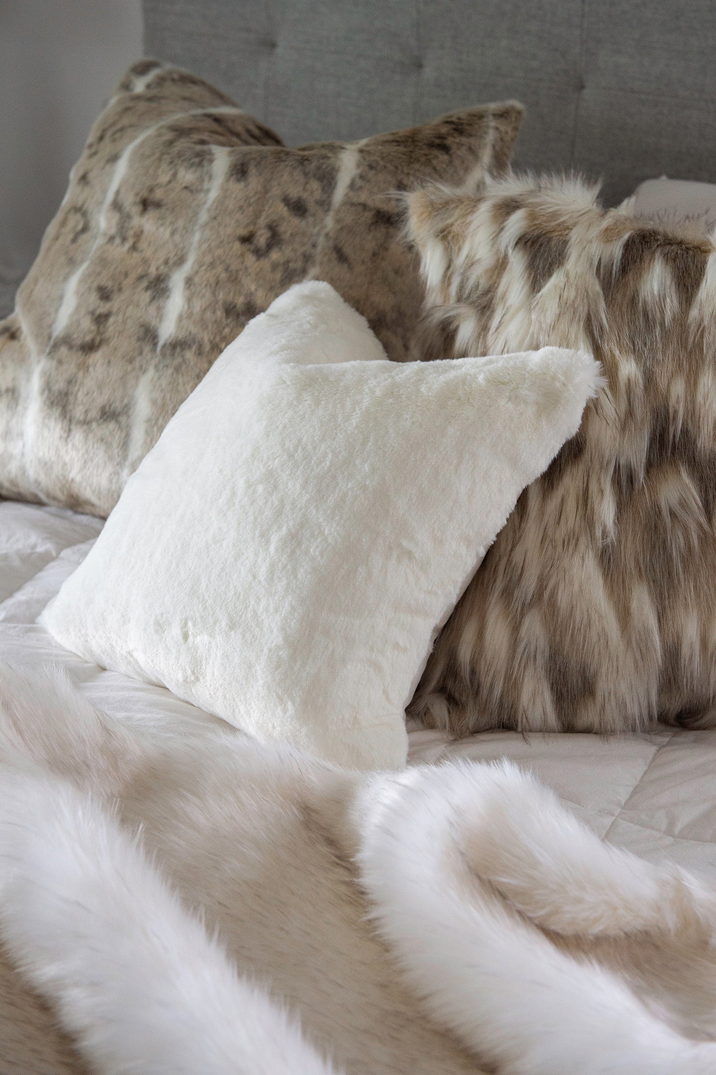 Luxury faux fur cushion in cream and brown from Heirloom. These are the best fake fur throws, super soft for NZ interior design